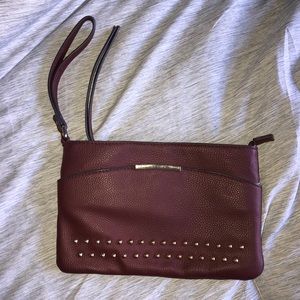 Jennifer Lopez, maroon wristlet clutch